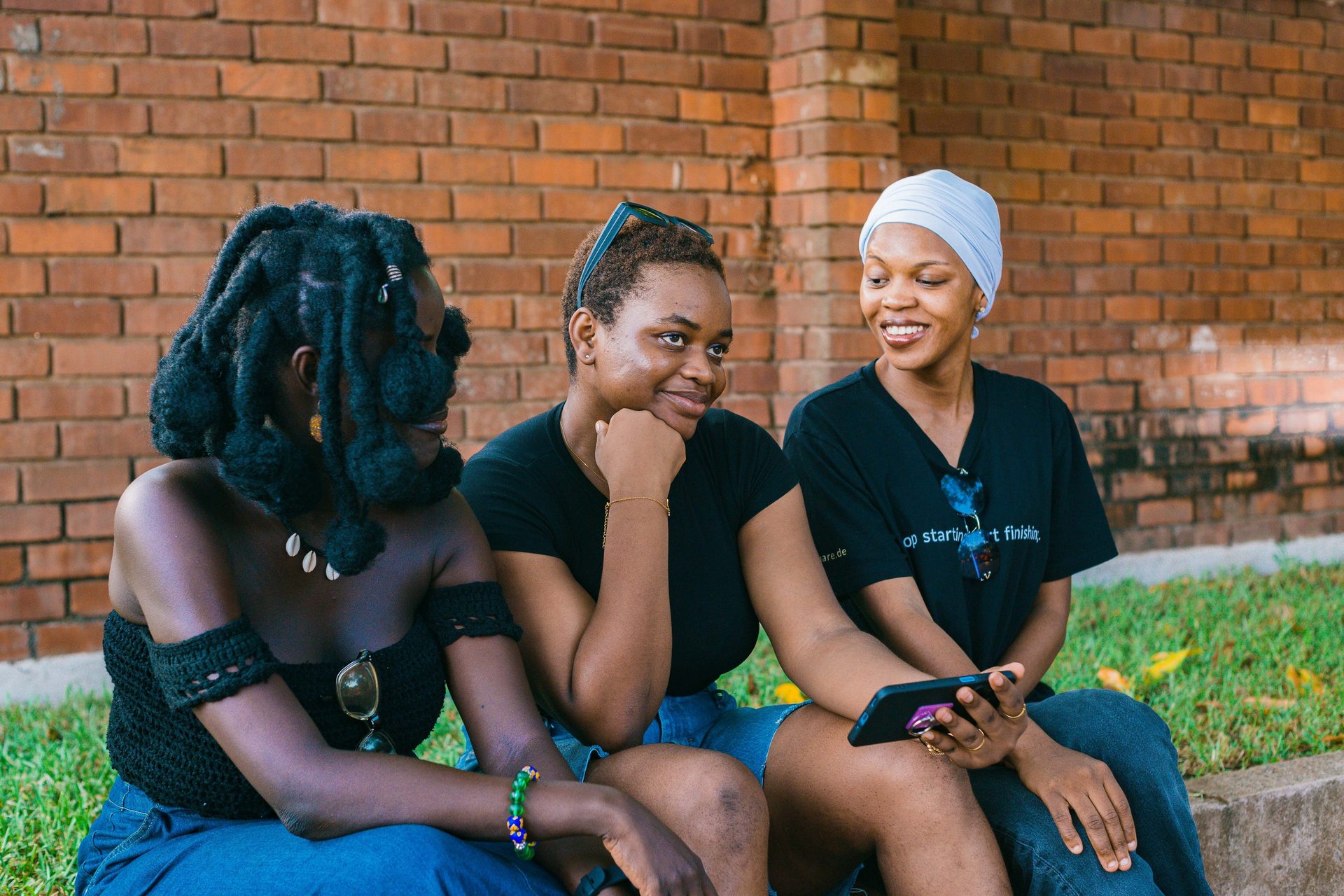 Three young women sitting together in conversation